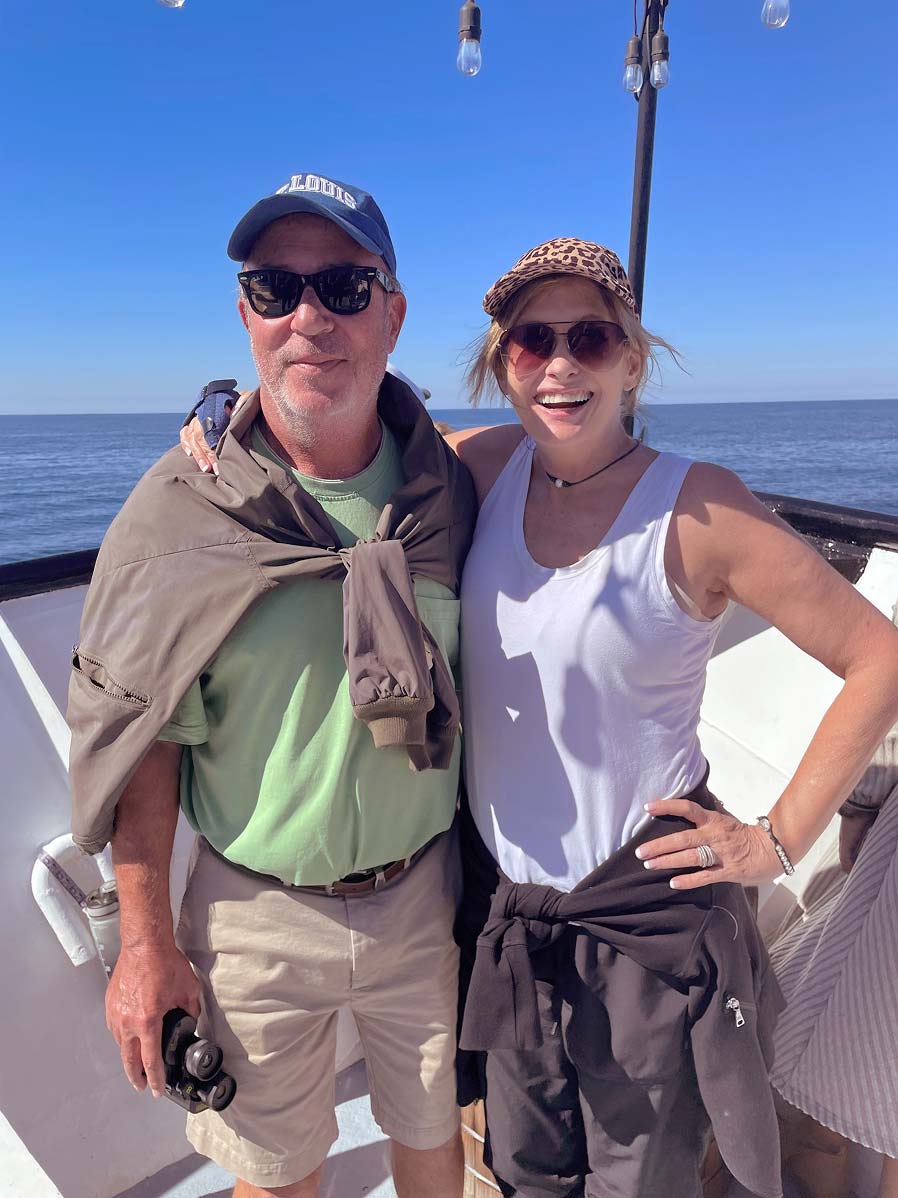 Sharon and Chris on a boat smiling